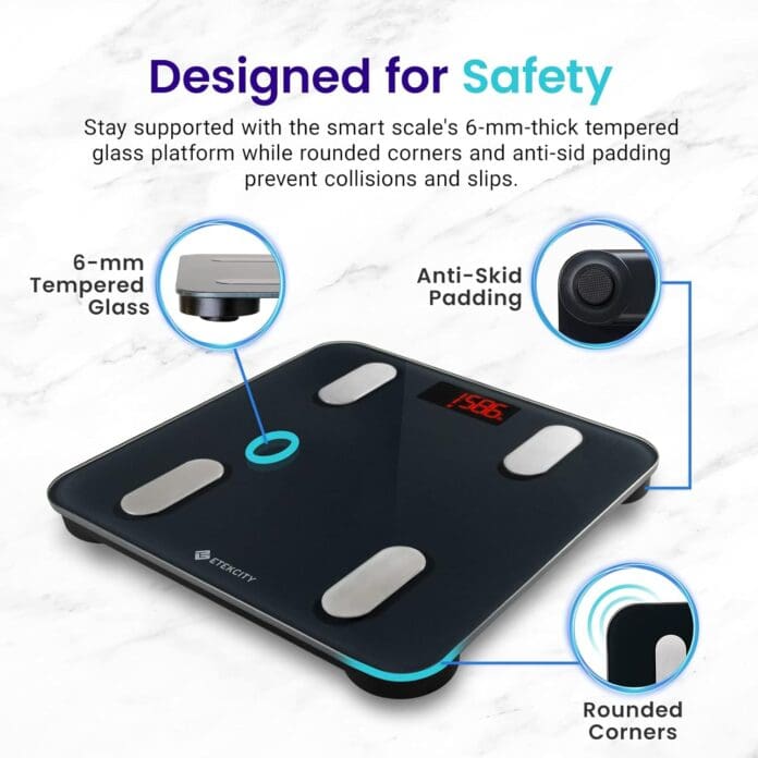 Smart digital scale with labeled safety features including 6-mm-thick tempered glass, anti-skid padding, and rounded corners, shown on a marble surface background.